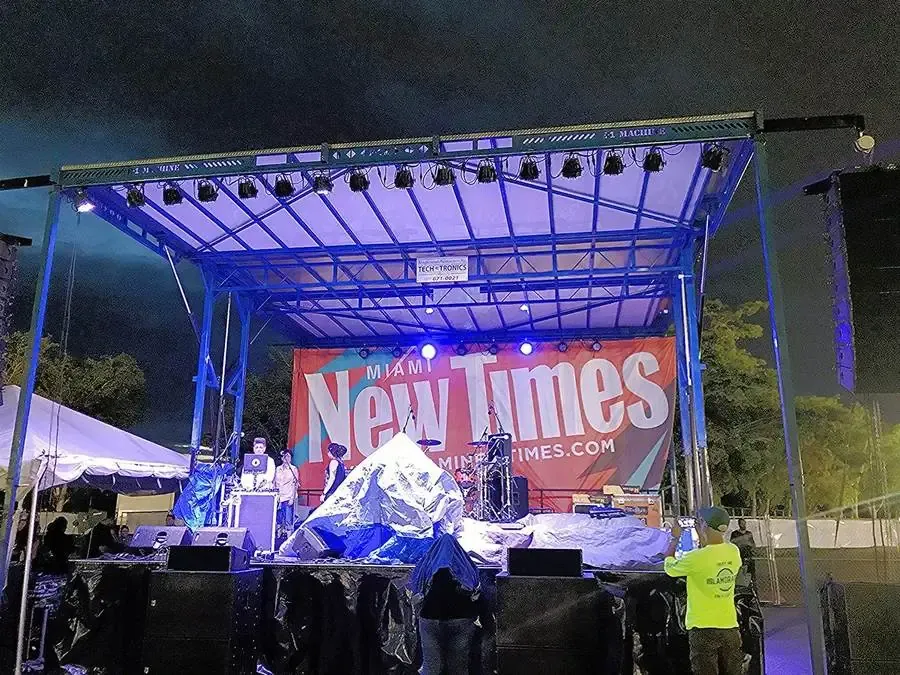 APEX 2420 stage lit blue at a New Times showcase event