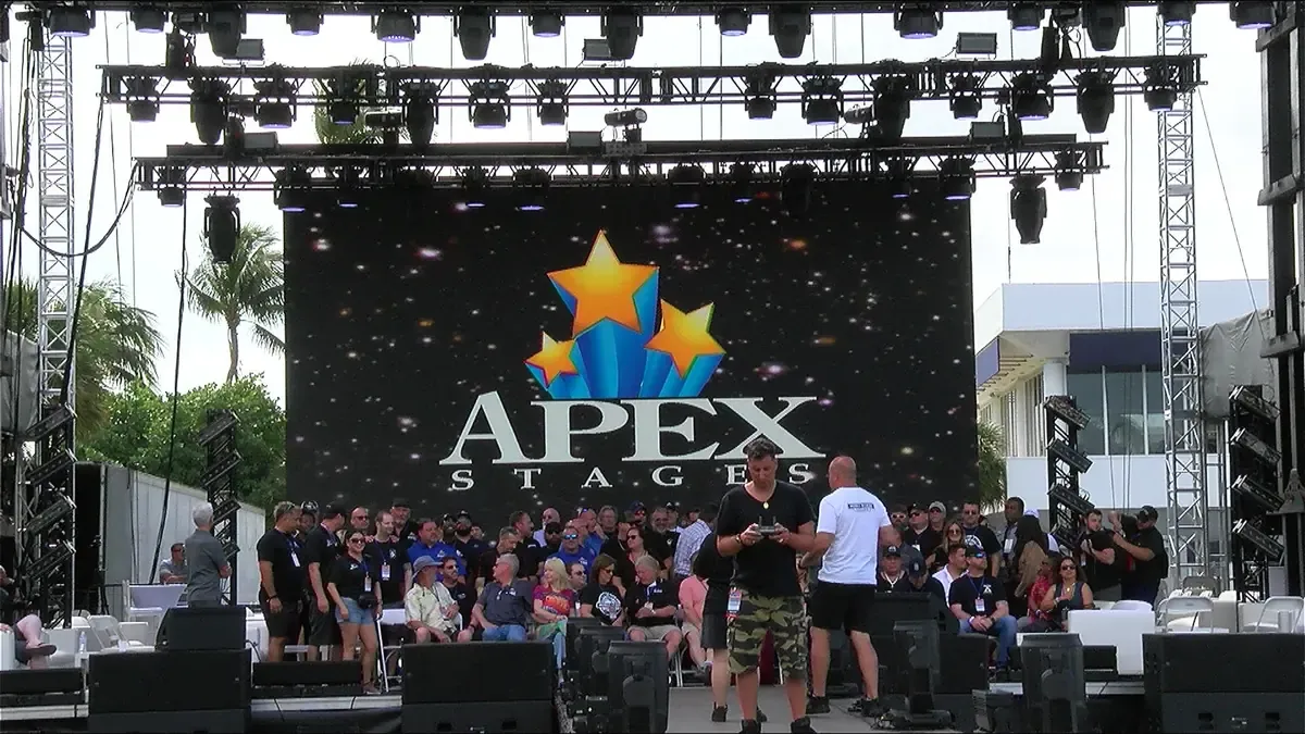 APEX stage and LED wall in front of a packed crowd