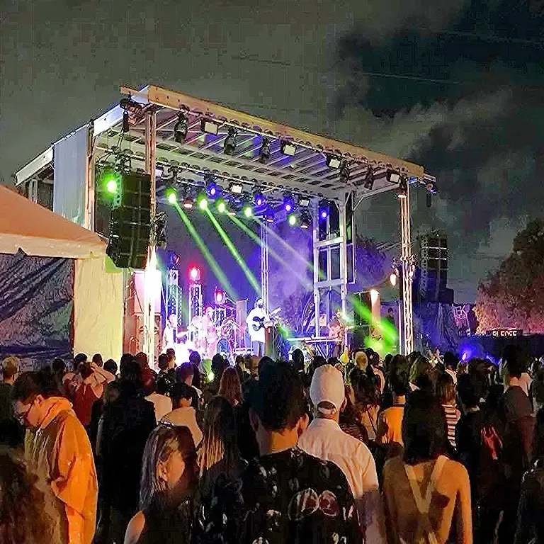 APEX 2424 stage lit up at night in front of a packed FloydFest crowd