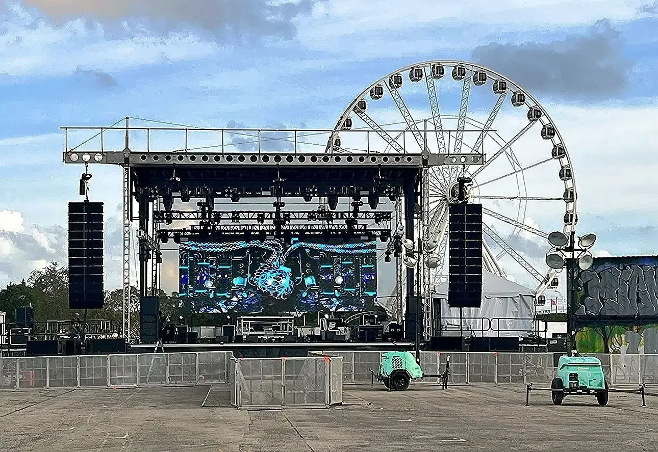APEX 4240 stage built at a fairground beside a ferris wheel