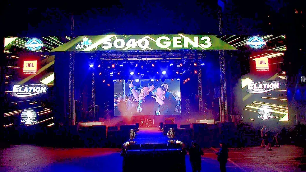APEX 5040 GEN3 stage built out with line arrays and video wall