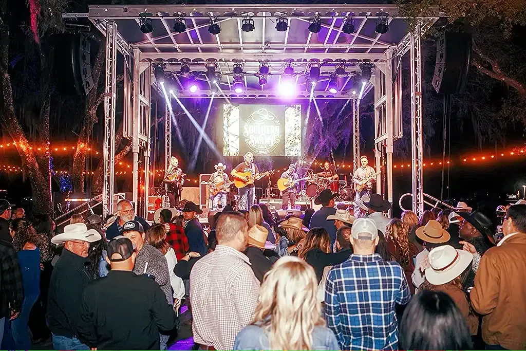 Concert lighting rig over a live audience